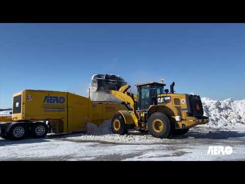 Airport Snow Loader Loading a Snow Melter